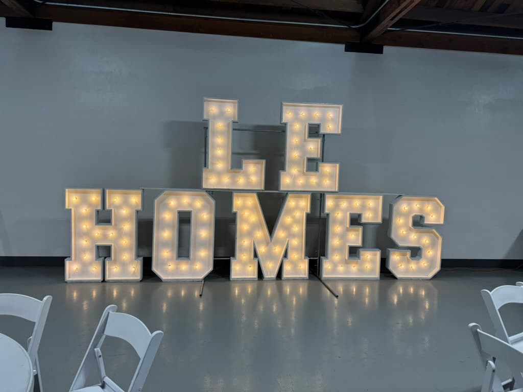 LE HOMES marquee letters for a corporate or brand event